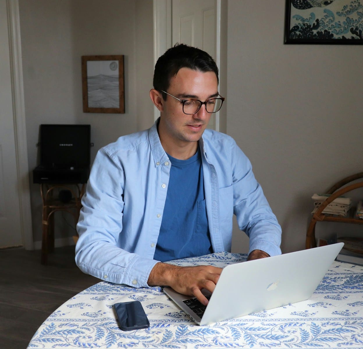 man in white dress shirt wearing black framed eyeglasses